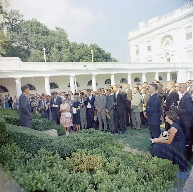 President Kennedy with the first group of Peace Corps volunteers in the White House Rose Garden, 1961