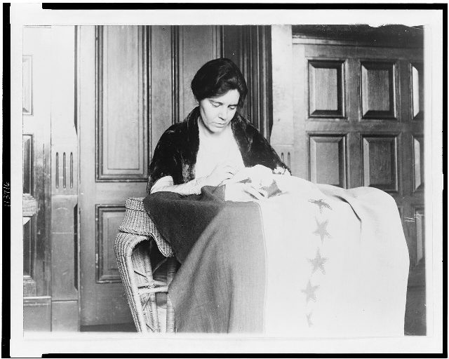 Alice Paul sewing the 36th star onto the National Woman's Party ratification banner, marking Tennessee's decisive ratification of the 19th Amendment.