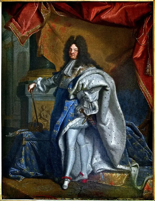 Hyacinthe Rigaud's grand portrait of Louis XIV in coronation robes, crown beside him, embodying the absolute monarchy that revoked the Edict of Nantes.
