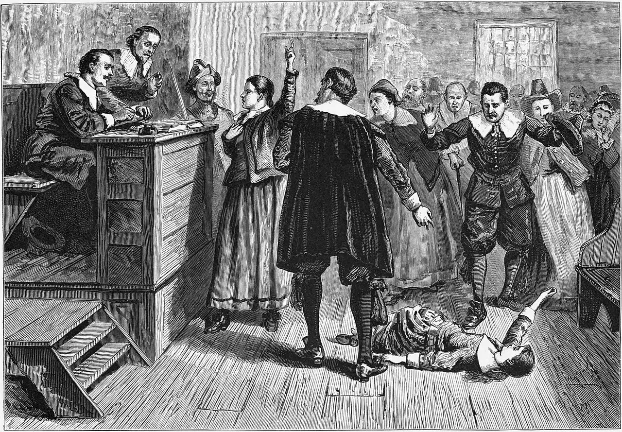 A 19th-century engraving depicting a witchcraft trial at Salem Village, with an afflicted accuser collapsed in fits on the courtroom floor.