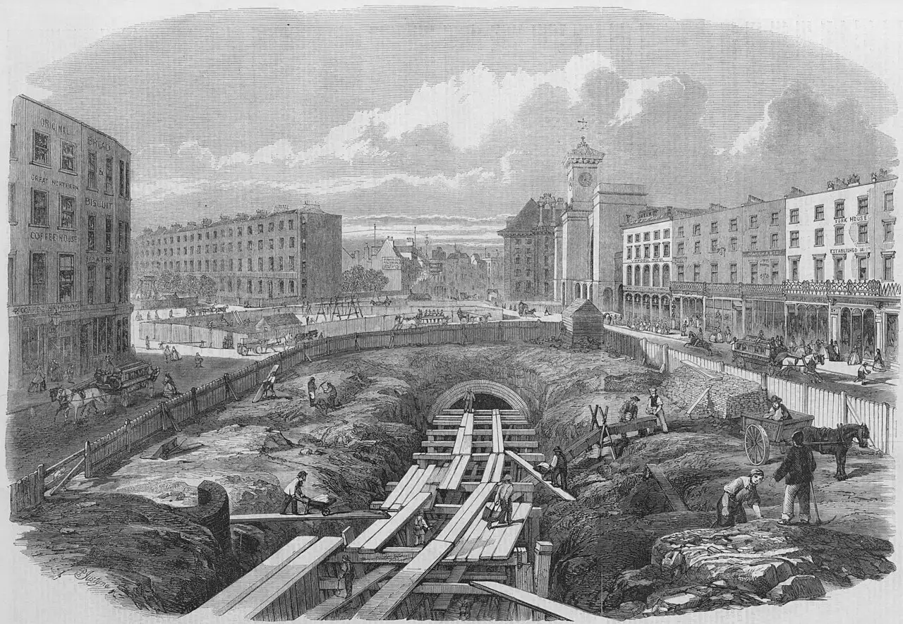 An 1860s engraving showing workers digging the cut-and-cover trench for London's Metropolitan Railway, the world's first underground railway.
