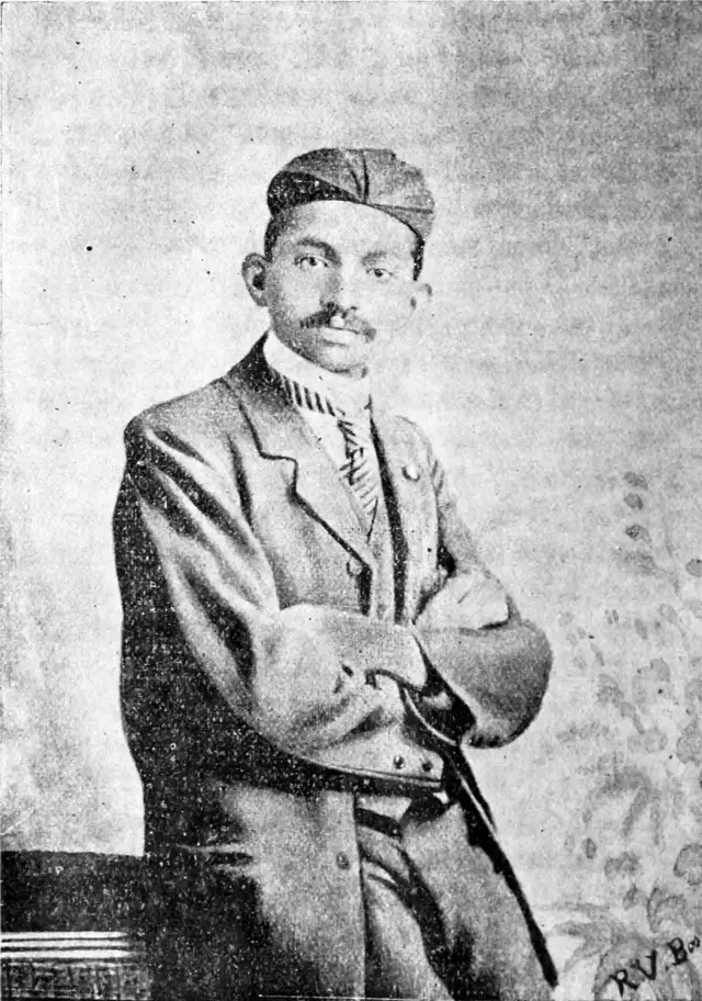Portrait of a young Mohandas Gandhi dressed as a barrister, illustration from a 1917 book. Illustrative image — not from the 1893 train incident itself.