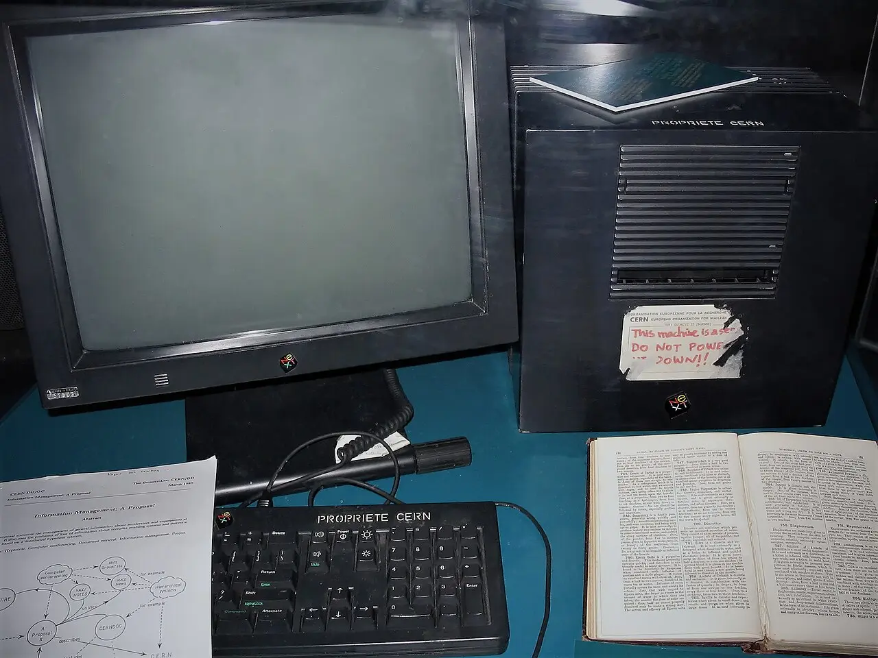 Illustrative: the NeXTcube computer Tim Berners-Lee used as the first web server, shown at CERN's Microcosm museum in 2005 — note the handwritten 'This machine is a server. Do NOT power down!!' sticker.