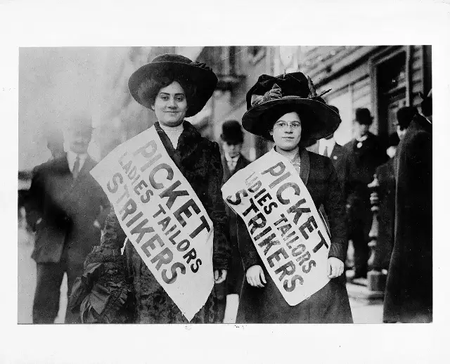Two women wearing 'Picket Ladies Tailors Strikers' sashes during the Ladies Tailors Strike in New York, February 1910.
