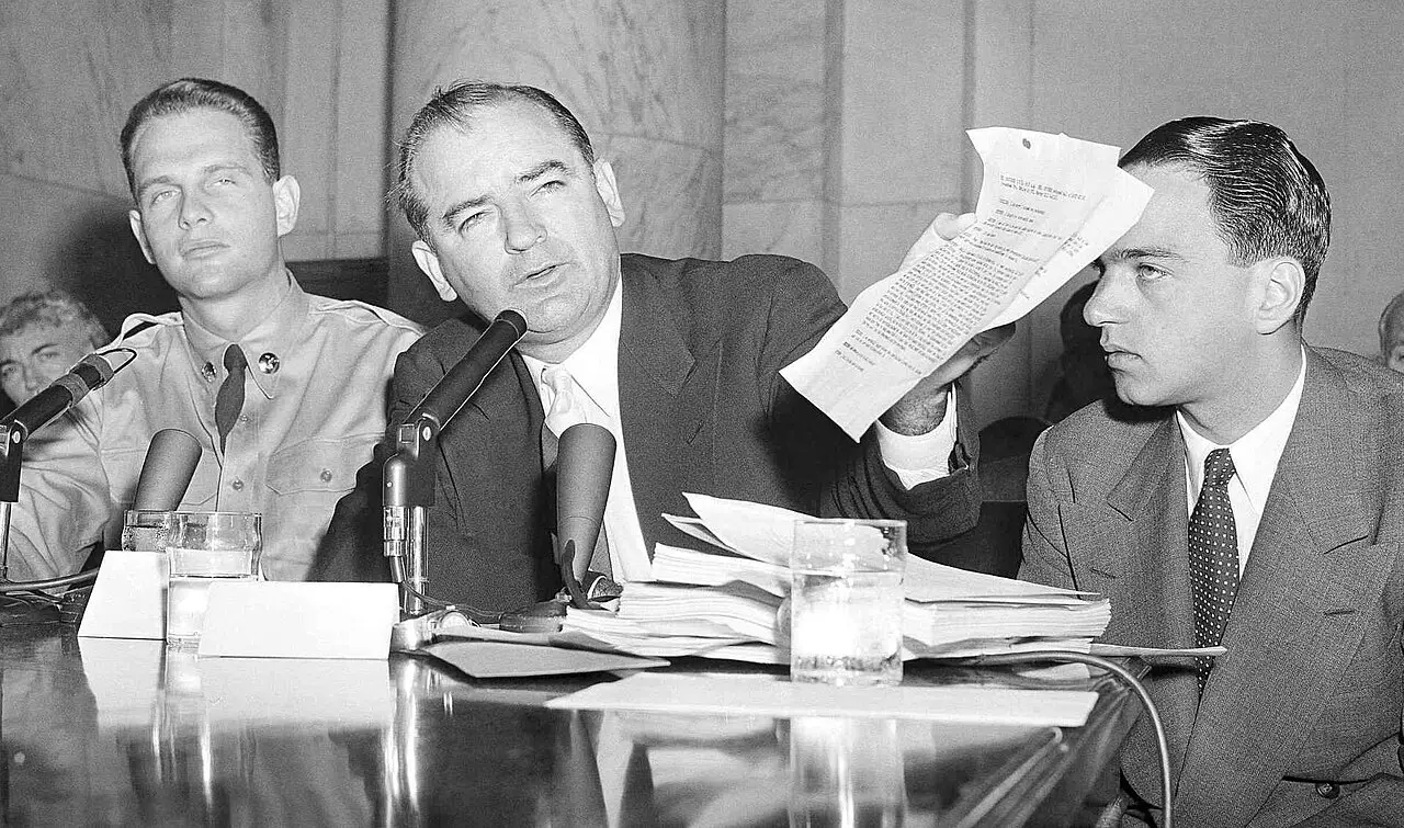 Senator Joseph McCarthy (center) with G. David Schine (left) and Roy Cohn (right) at the 1954 Army-McCarthy hearings.