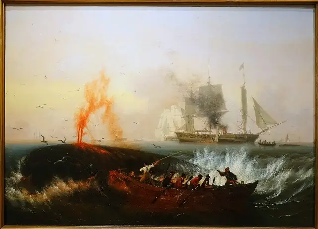 Ambroise Louis Garneray's c. 1835 oil painting of 19th-century whalers in a small boat attacking a whale, with their whaling ship behind — illustrative of the whaling industry of the Essex's era.