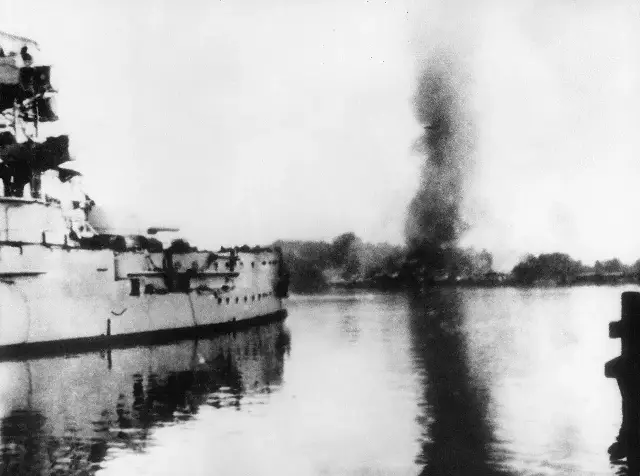 The German battleship Schleswig-Holstein fires on the Polish military depot at Westerplatte, Gdansk, on September 1, 1939, in the opening attack of World War II.