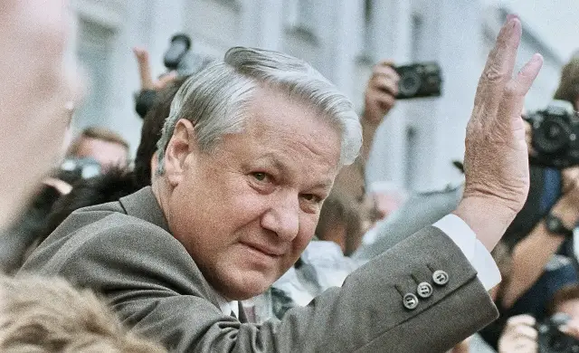 Boris Yeltsin waving to a crowd of photographers