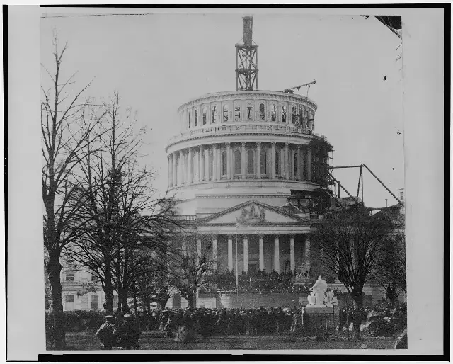 Crowd at Abraham Lincoln's first inauguration before the U.S. Capitol, whose dome was still under construction, March 4, 1861.