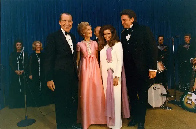 Johnny Cash and June Carter Cash on stage after a White House concert in 1970, with President Richard Nixon and Pat Nixon
