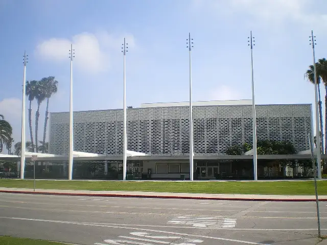 Exterior of the Santa Monica Civic Auditorium on a sunny day — the venue that hosted the 36th Academy Awards in 1964, shown as an illustration