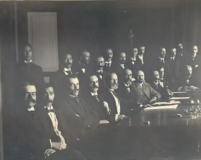 The signatories of the Boxer Protocol seated around a table at the signing in Beijing, September 1901.
