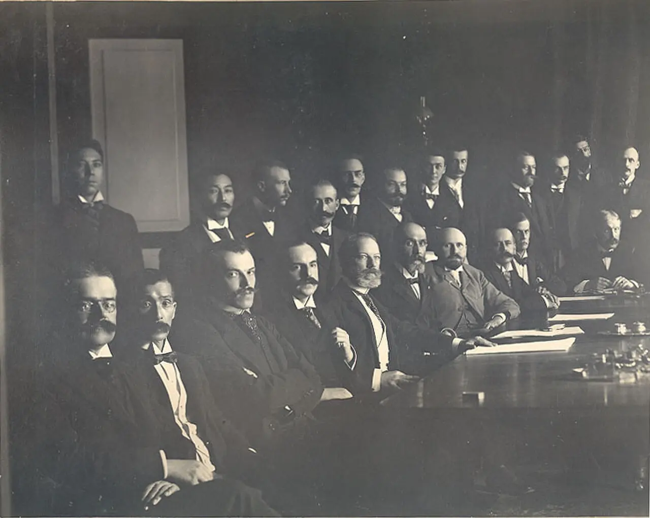 The signatories of the Boxer Protocol seated around a table at the signing in Beijing, September 1901.