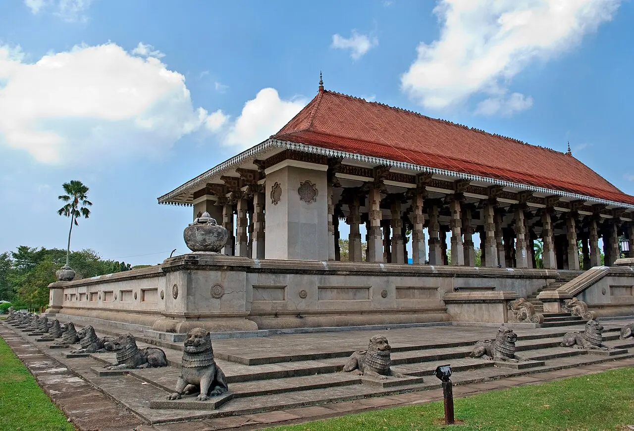 The Independence Memorial Hall in Colombo, Sri Lanka, a stone pavilion with a red-tiled roof ringed by lion statues