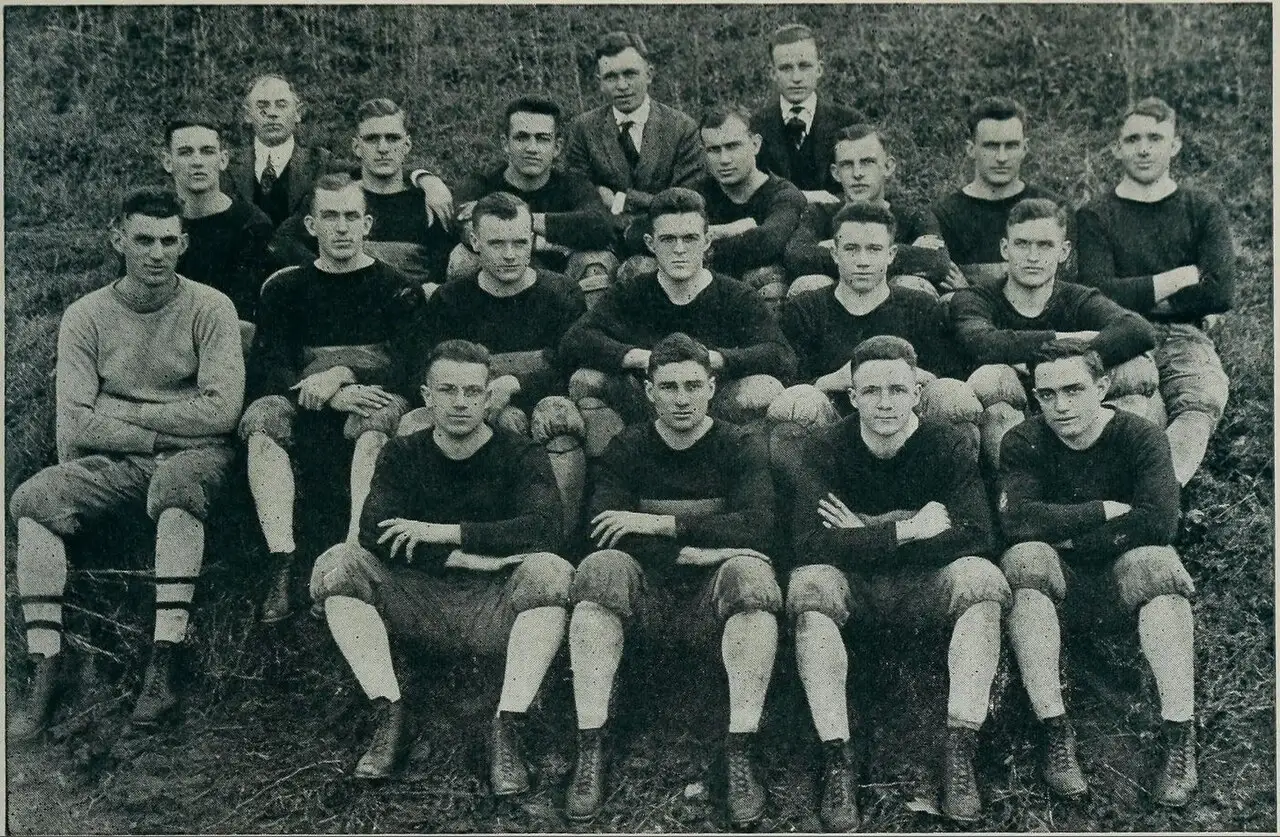 The 1916 Georgia Tech Yellow Jackets football team posing for a group photograph, with coach John Heisman seated at front center.