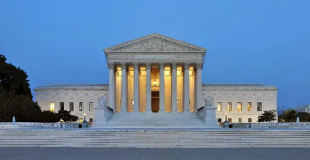 Panorama of the west facade of the United States Supreme Court Building at dusk in Washington, D.C.
