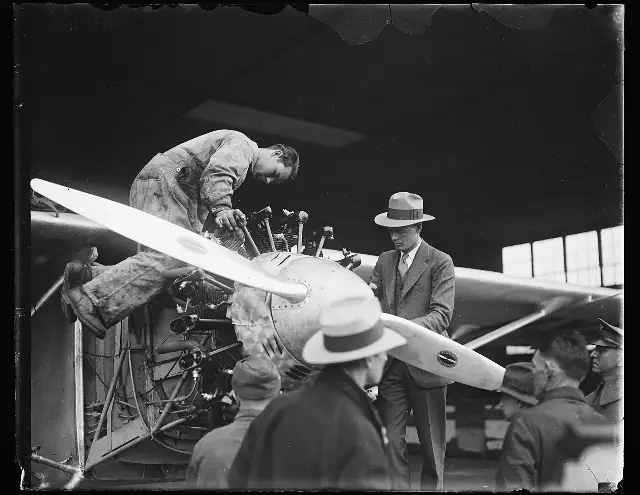 Charles Lindbergh with the Spirit of St. Louis in a 1927 Harris & Ewing photograph from the year of the flight (not taken at the departure itself).