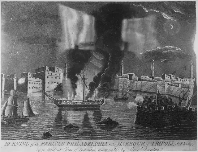 An 1804 engraving showing the frigate Philadelphia burning in Tripoli harbor, captioned '16th Feb 1804'