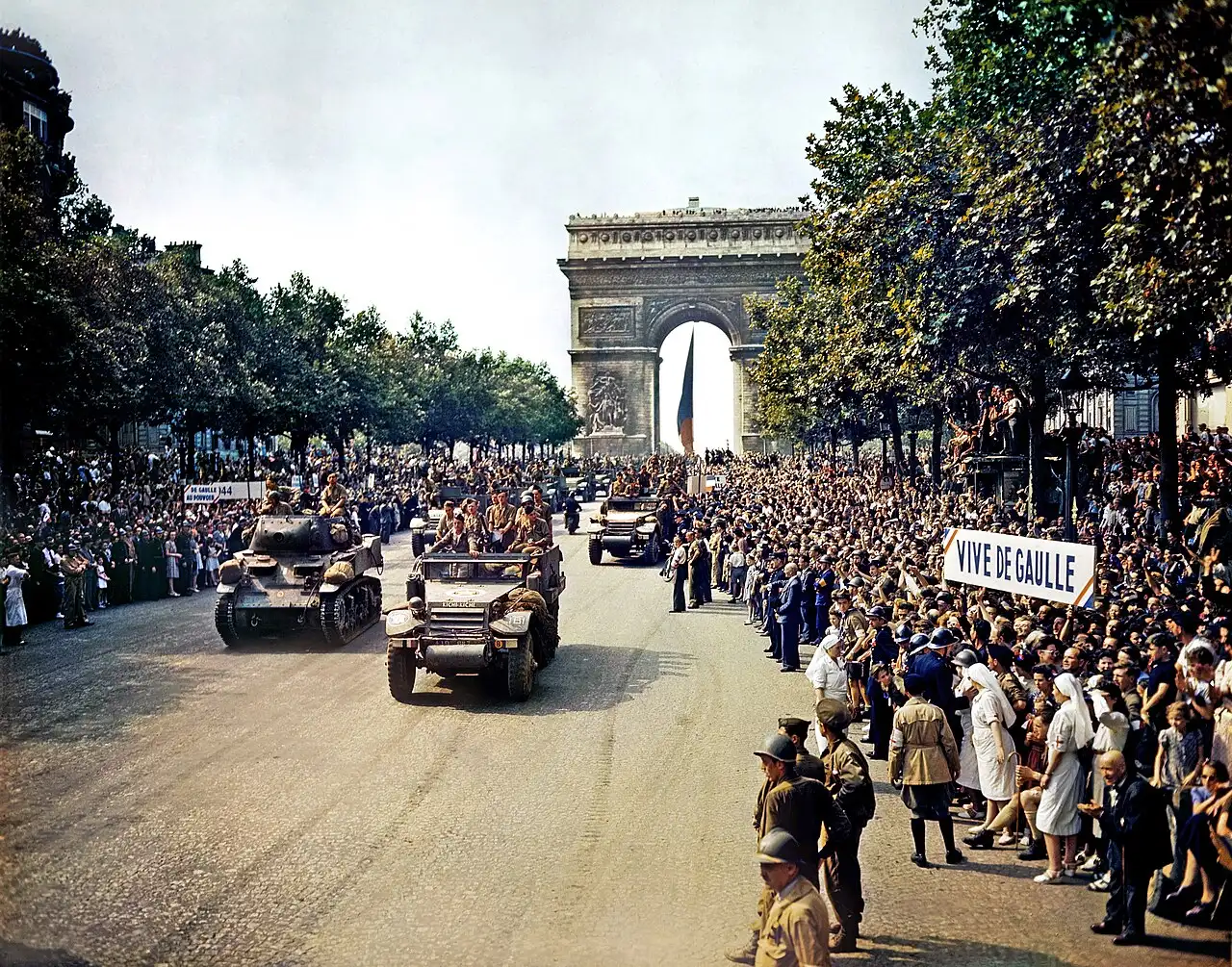 Crowds line the Champs-Elysees for the victory parade on August 26, 1944, the day after Paris was liberated, as soldiers of the French 2nd Armored Division pass the Arc de Triomphe.