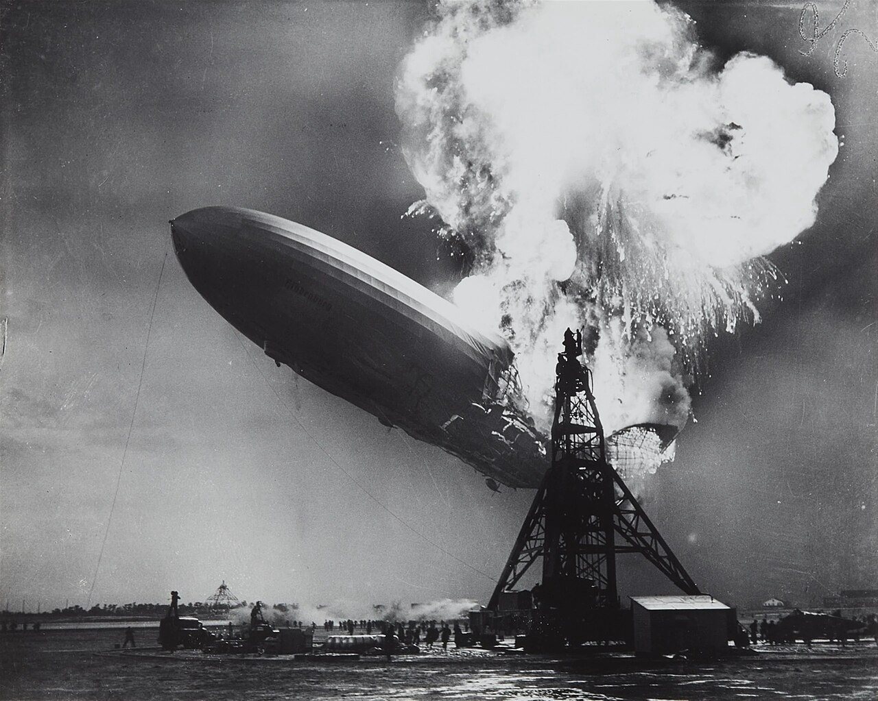 The German airship Hindenburg burning at its mooring mast at Lakehurst, New Jersey, on May 6, 1937.