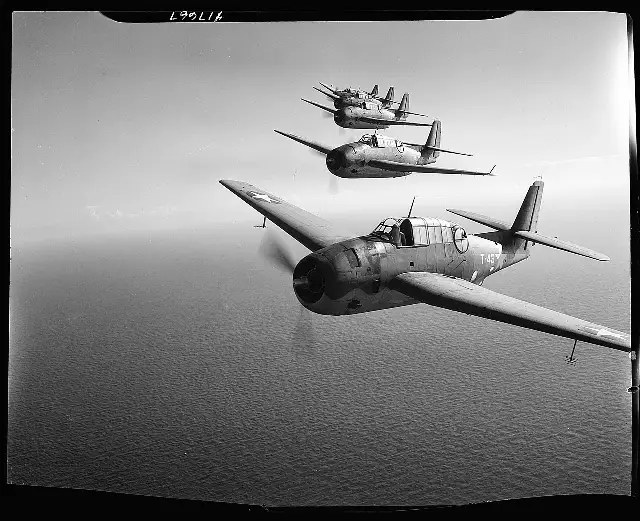 Five U.S. Navy TBF Avenger torpedo bombers flying in formation over the ocean near Fort Lauderdale, Florida, photographed by Horace Bristol