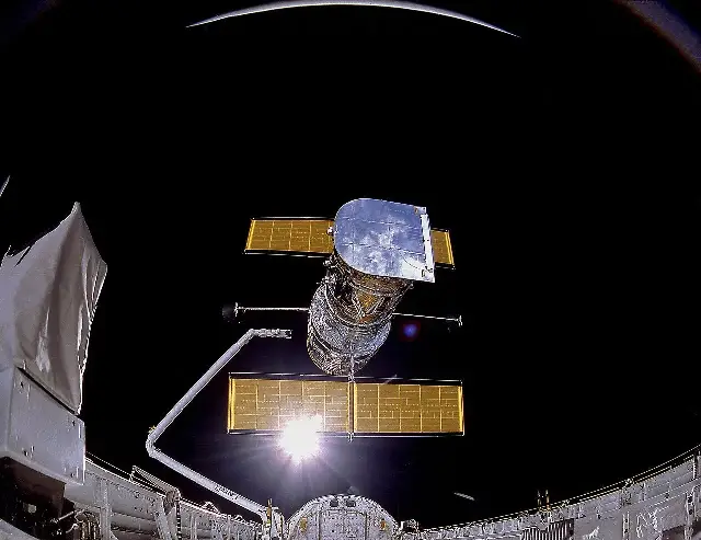 The Hubble Space Telescope drifting above Discovery's cargo bay just after its release on April 25, 1990.