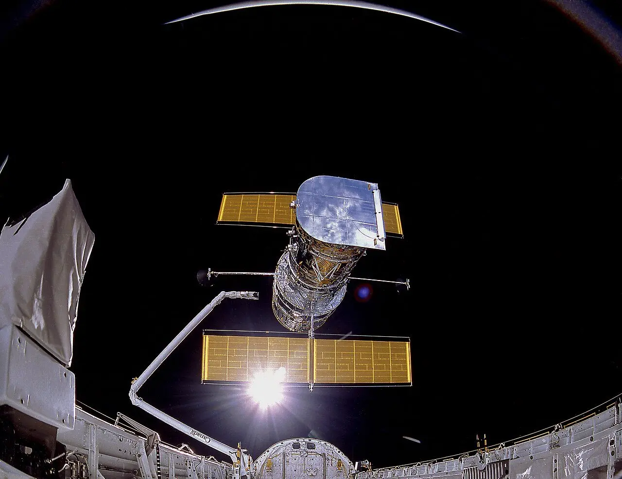The Hubble Space Telescope drifting above Discovery's cargo bay just after its release on April 25, 1990.