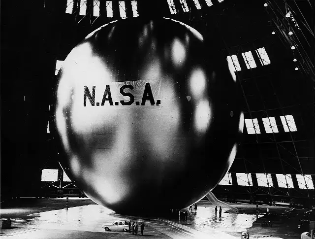 Echo 1, NASA's 100-foot communications balloon, fully inflated inside a Navy hangar before its 1960 launch.