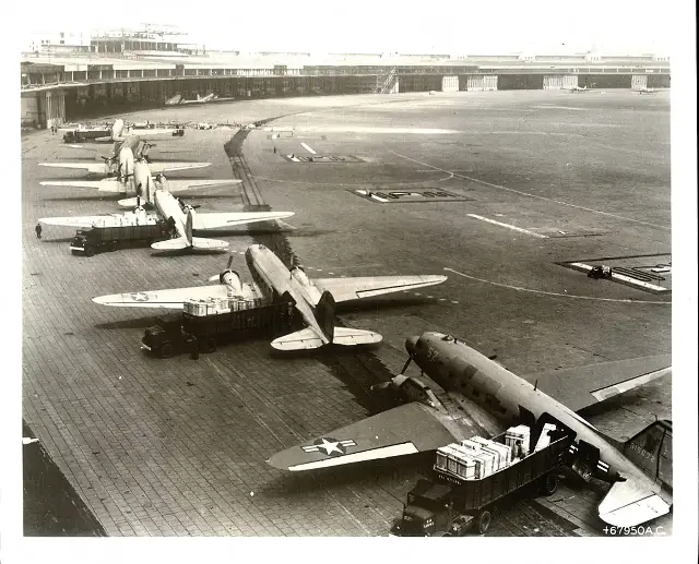 C-47 cargo planes being unloaded at Tempelhof Airport during the Berlin Airlift, 1948–49.