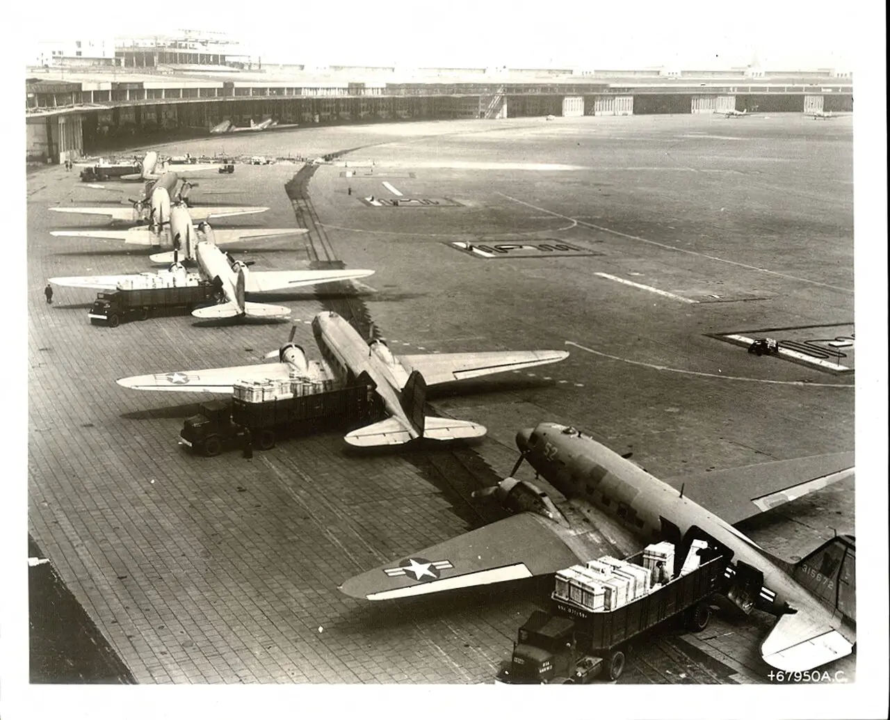 C-47 cargo planes being unloaded at Tempelhof Airport during the Berlin Airlift, 1948–49.
