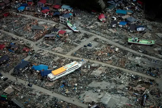 Aerial view of a ferry beached among destroyed houses after the 2011 Tohoku earthquake and tsunami