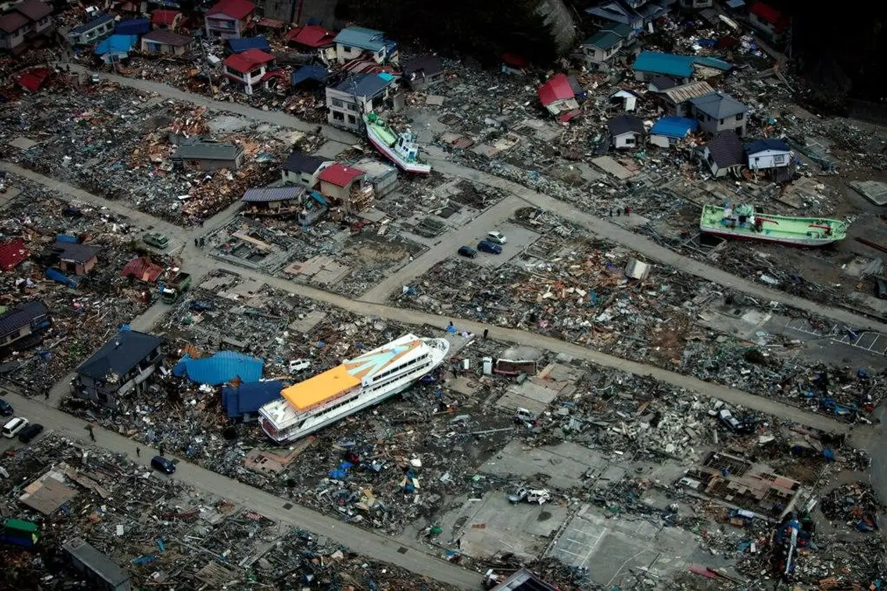 Aerial view of a ferry beached among destroyed houses after the 2011 Tohoku earthquake and tsunami