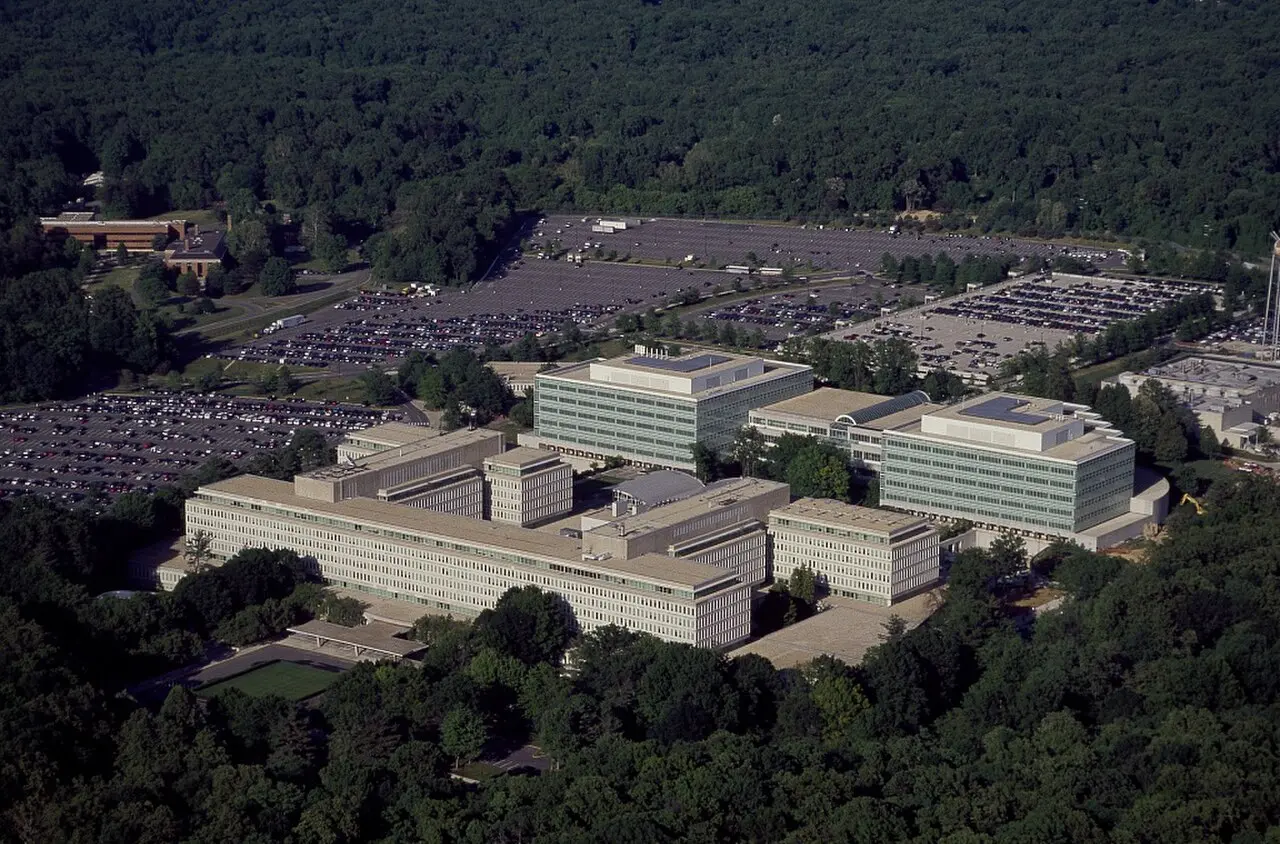 Aerial photograph of the CIA headquarters campus in Langley, Virginia, showing office buildings surrounded by trees