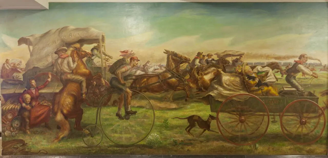John Steuart Curry's mural of the 1889 Oklahoma Land Rush: settlers racing on horseback, in wagons, and on a high-wheel bicycle, beneath a wagon banner reading 'Oklahoma or Bust.'