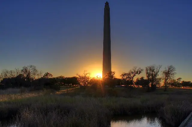 The San Jacinto Monument at sunset, standing on the Texas battlefield where Houston's Texians won independence in 1836.