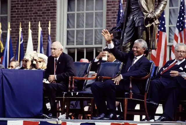 F. W. de Klerk and Nelson Mandela seated together on a stage at an event in Philadelphia, Pennsylvania.