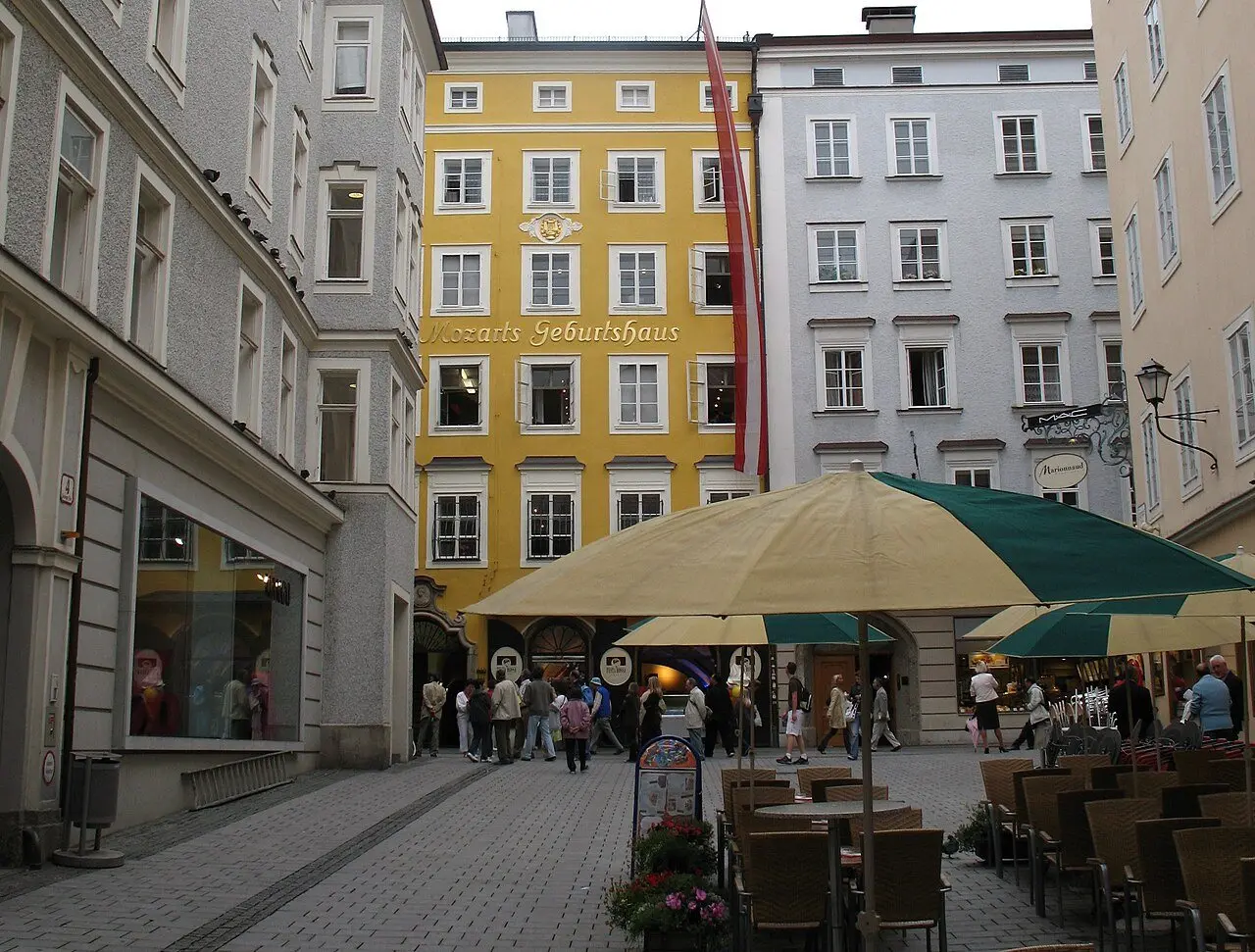 The yellow Mozart Geburtshaus building at Getreidegasse 9 in Salzburg, Austria, birthplace of Wolfgang Amadeus Mozart (modern photo).