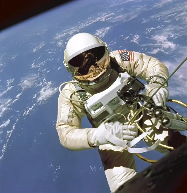 Astronaut Ed White floating outside the Gemini 4 capsule during the first American spacewalk on June 3, 1965, photographed by Jim McDivitt.