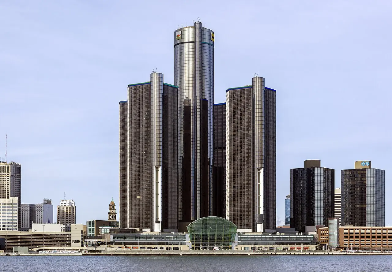The General Motors Renaissance Center headquarters in Detroit, Michigan, a cluster of glass skyscrapers on the Detroit riverfront photographed from the south.