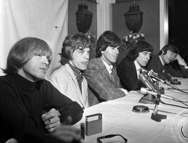 The Rolling Stones — Brian Jones, Mick Jagger, Keith Richards, Bill Wyman and Charlie Watts — at a 1965 press conference in Beverly Hills.