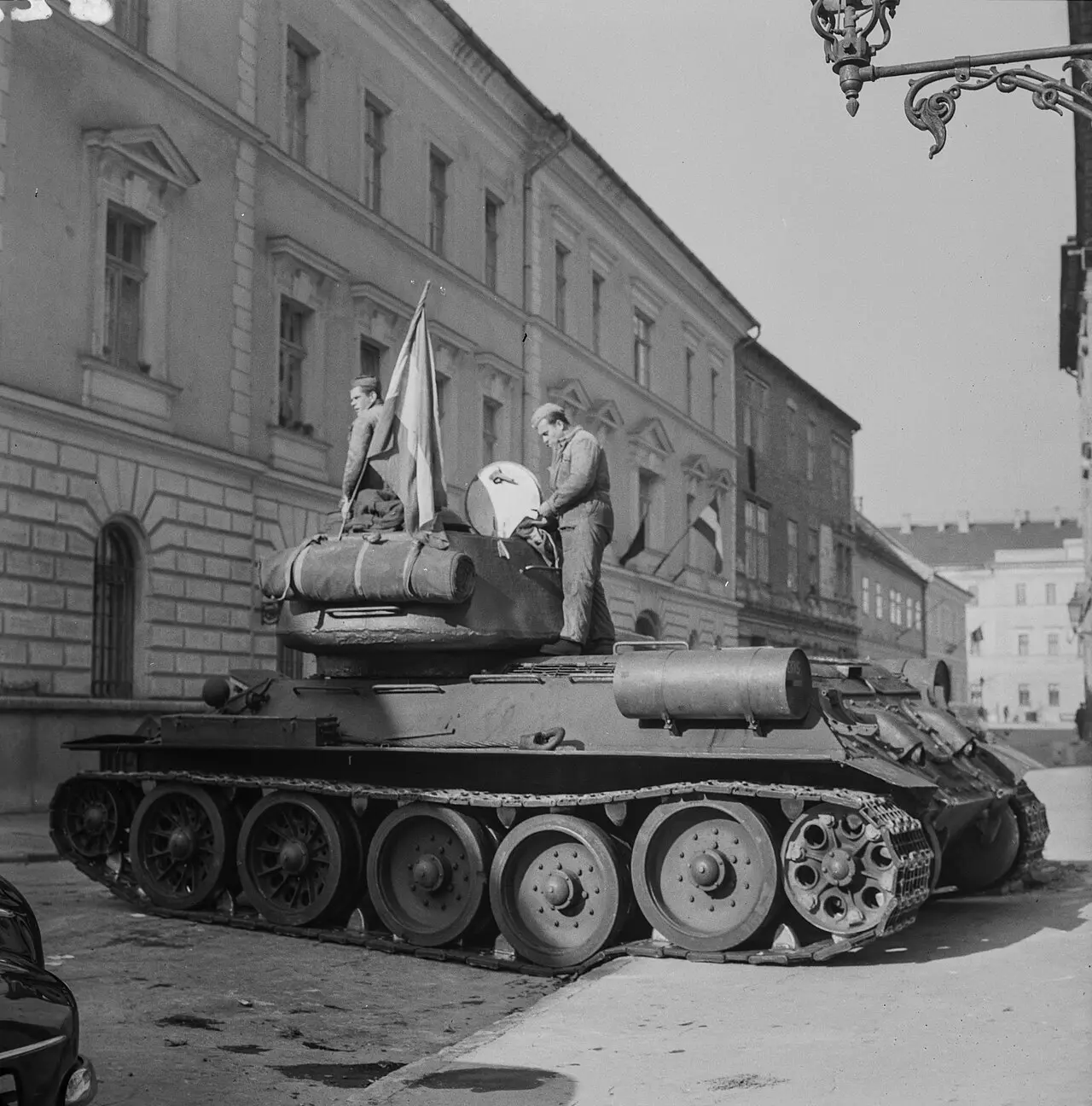 A Soviet T-34-85 tank flying a Hungarian flag on a Budapest street during the 1956 uprising.