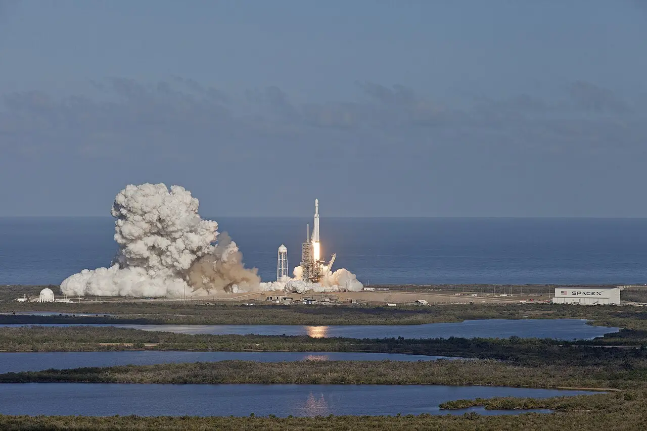 The Falcon Heavy rocket lifting off from Launch Complex 39A on February 6, 2018, with a huge plume of smoke