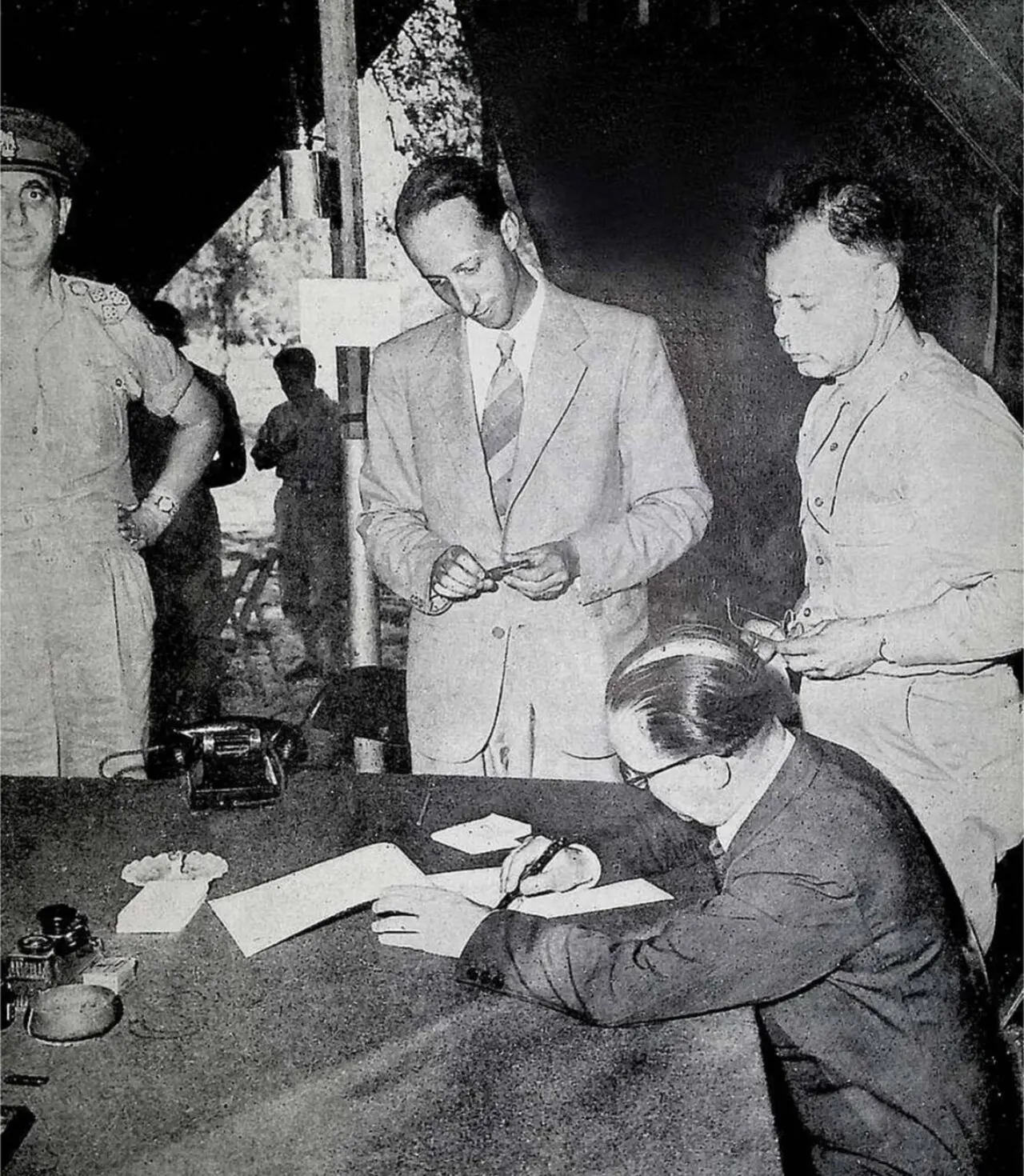 General Giuseppe Castellano signing the armistice at Cassibile on September 3, 1943, watched by General Walter Bedell Smith; the armistice was announced on September 8.