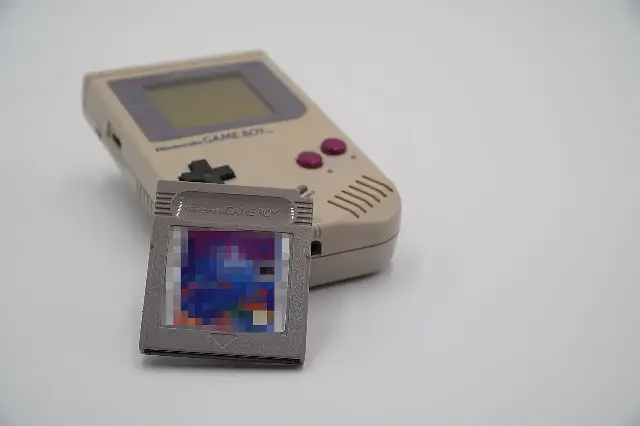 A Nintendo Game Boy with a Tetris game cartridge — the handheld pairing that carried Tetris around the world.