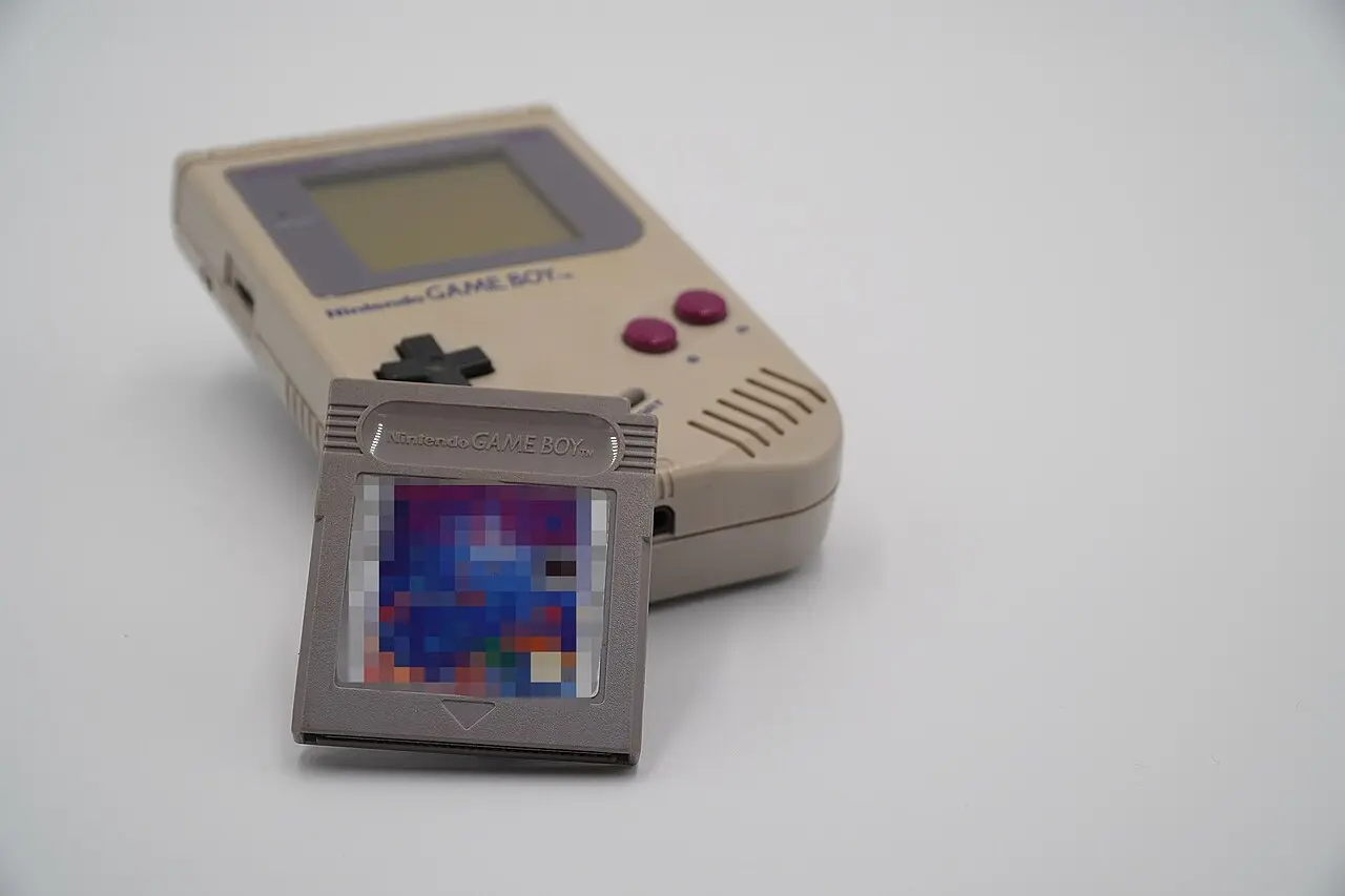 A Nintendo Game Boy with a Tetris game cartridge — the handheld pairing that carried Tetris around the world.