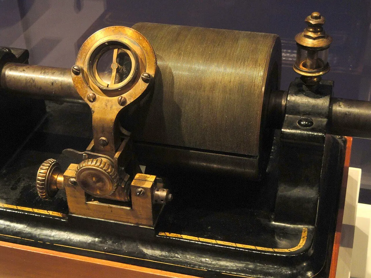 Edison's original 1878 tinfoil phonograph with its grooved cylinder and hand crank