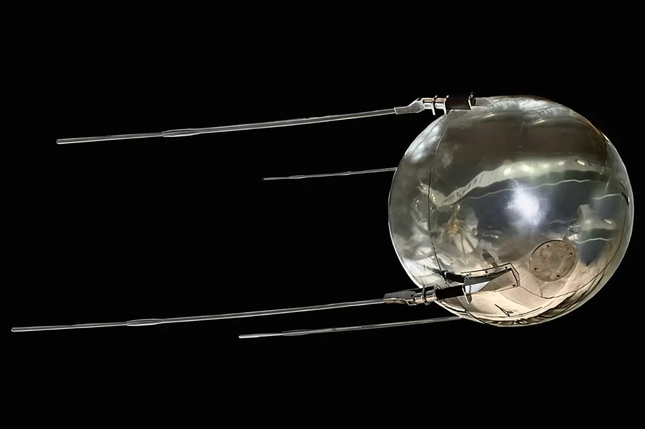 Full-scale model of Sputnik 1, a polished metal sphere with four trailing antennas
