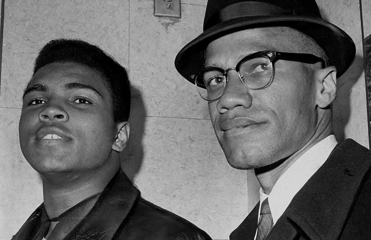 Malcolm X (right) with boxer Muhammad Ali, then known as Cassius Clay, in a 1964 United Press International photograph taken in New York.