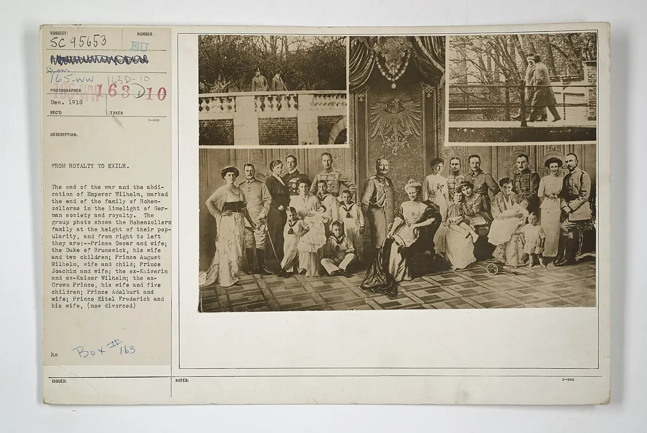 A 1918 U.S. Army Signal Corps photo card titled 'From Royalty to Exile,' showing the Hohenzollern family after Kaiser Wilhelm II's abdication on November 9, 1918.