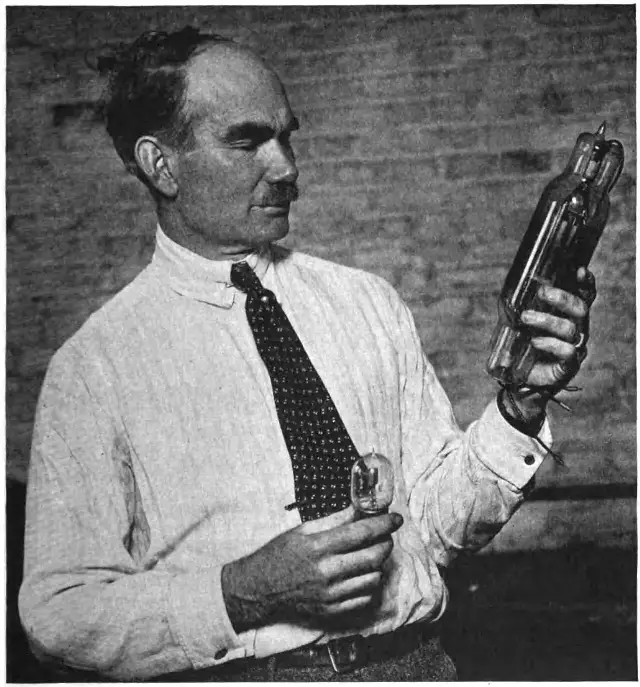 Inventor Lee de Forest holding Audion vacuum tubes, the devices that made radio amplification possible